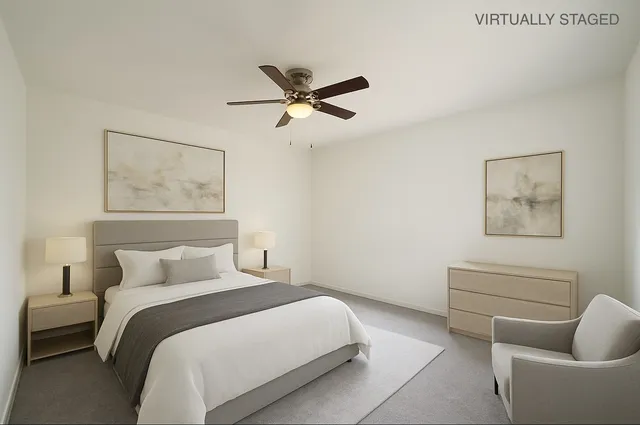 a bedroom with a bed and couch