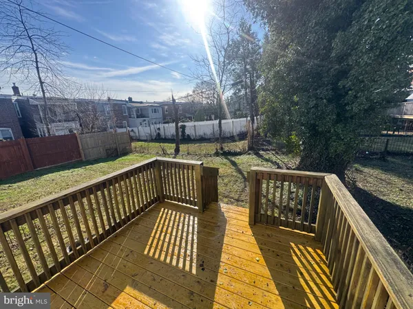 a view of balcony with wooden floor