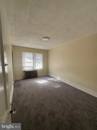 a view of empty room with windows