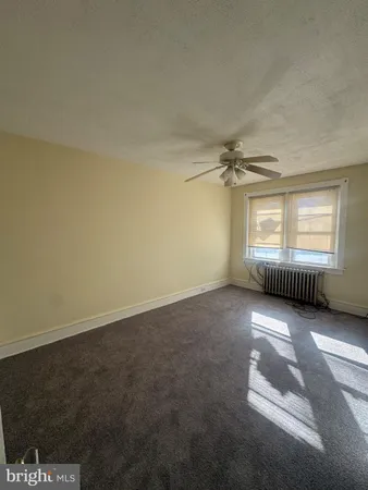 an empty room with a empty space and windows