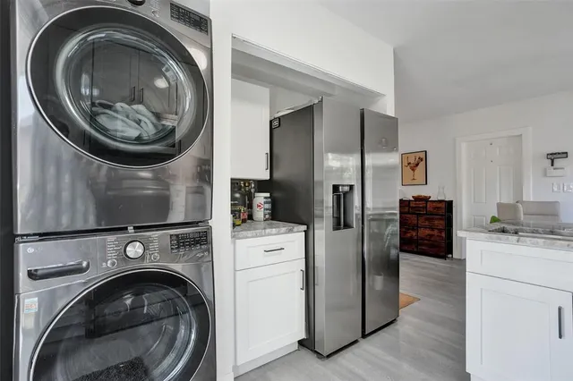 a kitchen with a washer and dryer