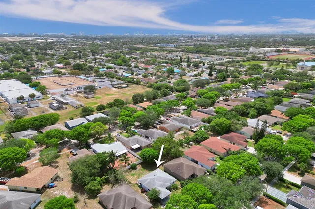 an aerial view of residential houses with outdoor space