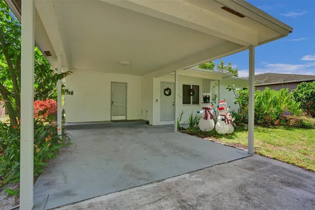 a view of a house with porch and furniture