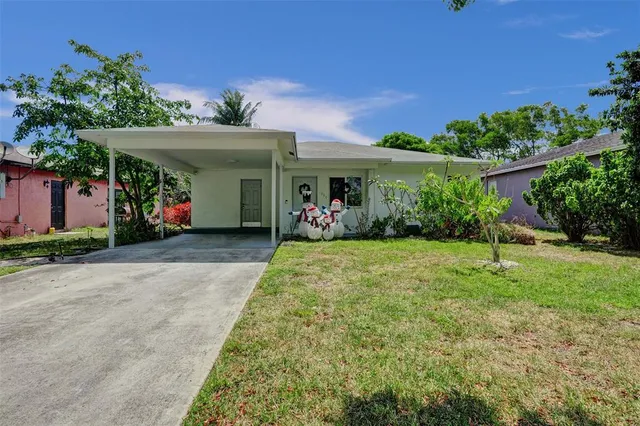 front view of house with a yard