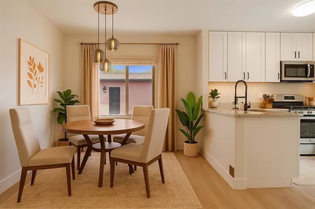 a dining room with furniture and window
