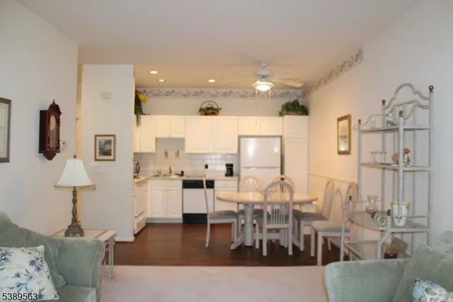 a living room with lots of furniture and a wooden floor