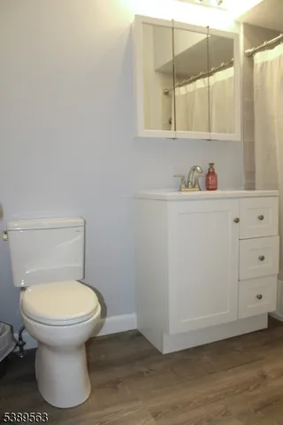 a bathroom with a toilet and a sink