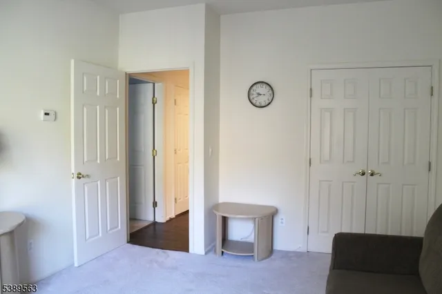 a view of room with furniture and windows