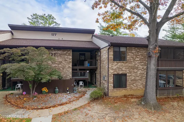 a picture of a wall next to a white house