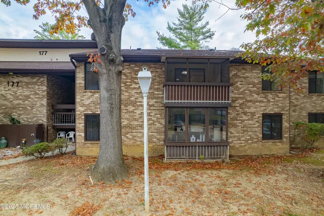 a view of a pathway with a house in the background