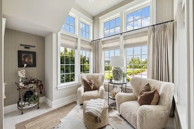 a front view of a house with yard and green space