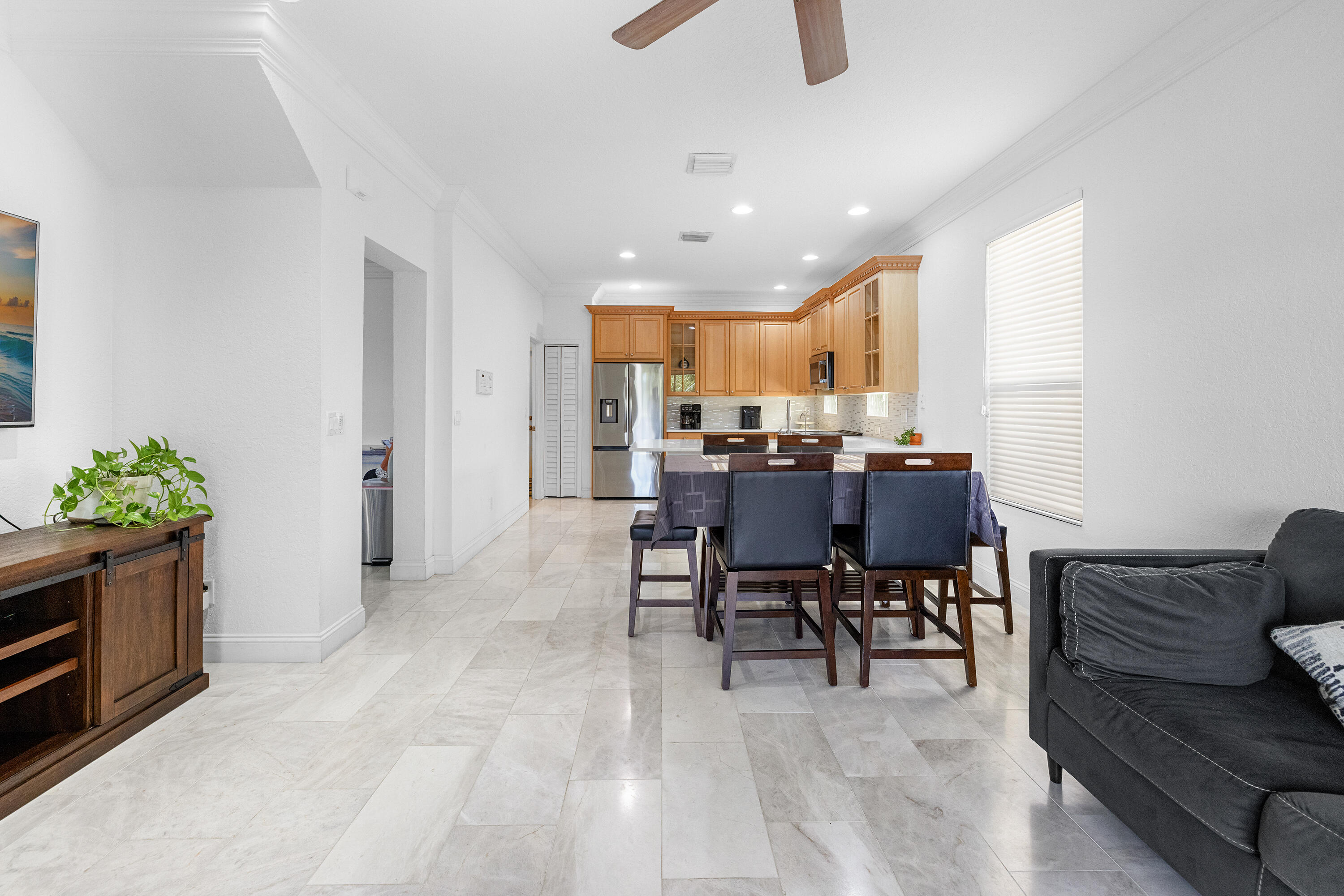 6575 Spring Meadow Drive Greenacres, FL 33413 - Photo 11 of 51 a view of a dining room with furniture