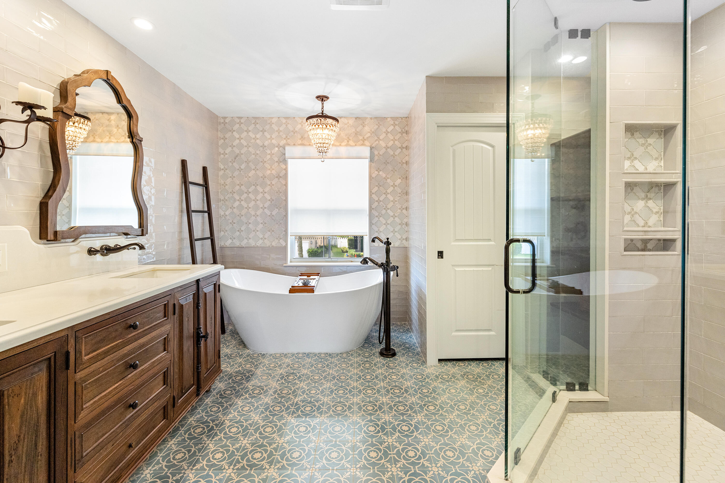 6575 Spring Meadow Drive Greenacres, FL 33413 - Photo 22 of 51 a bathroom with a tub sink shower and mirror