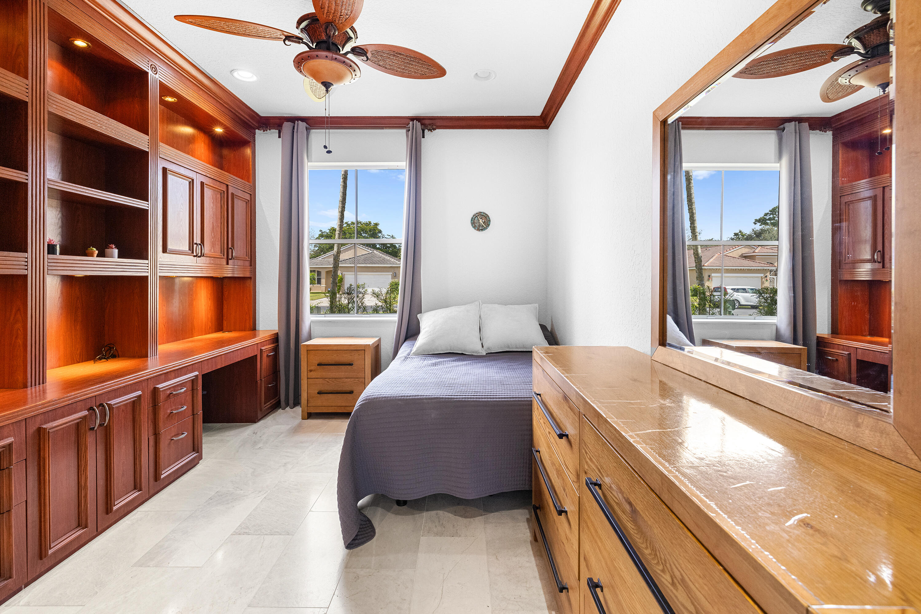 6575 Spring Meadow Drive Greenacres, FL 33413 - Photo 32 of 51 a bedroom with a bed and a large window with the outer view