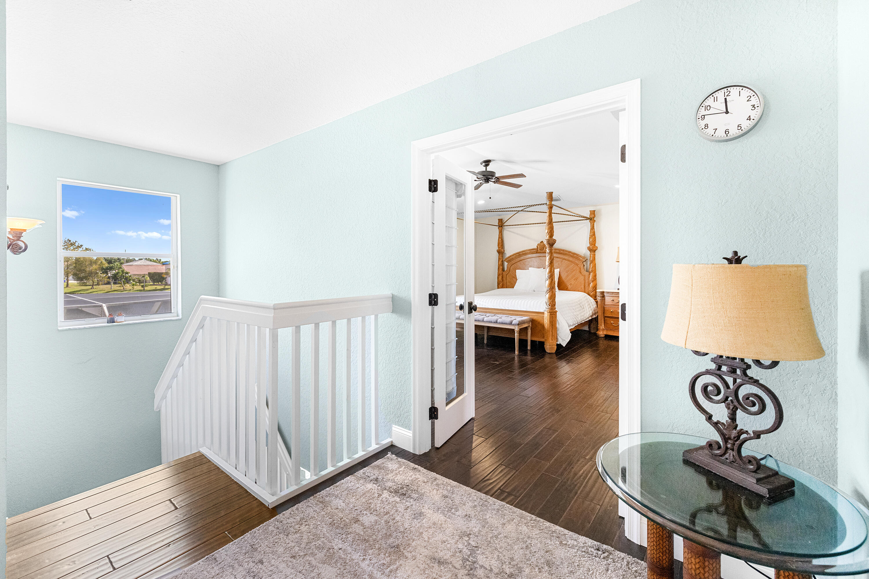 6575 Spring Meadow Drive Greenacres, FL 33413 - Photo 34 of 51 a bedroom with furniture and a wooden floor