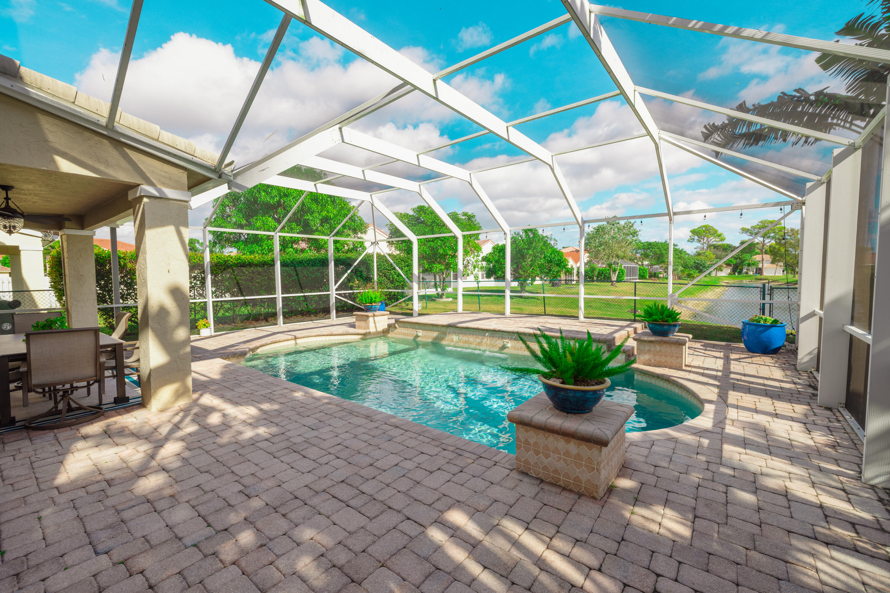 6575 Spring Meadow Drive Greenacres, FL 33413 - Photo 39 of 51 a view of a garden with a patio