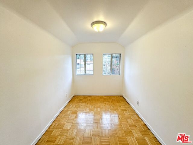 a lobby with furniture and a floor to ceiling window