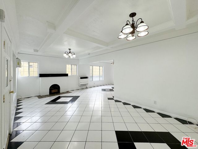a view of a livingroom with furniture and chandelier