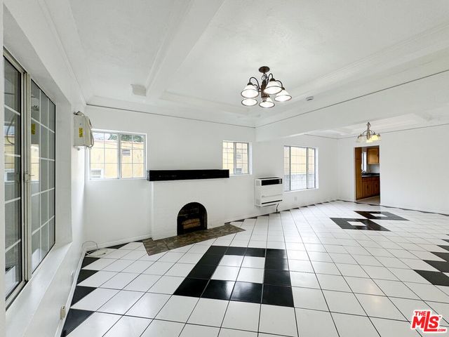 a view of an empty room and window