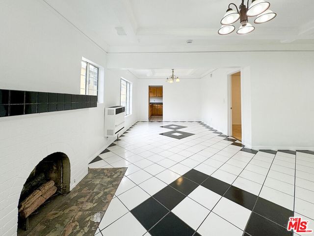 a view of an empty room and window