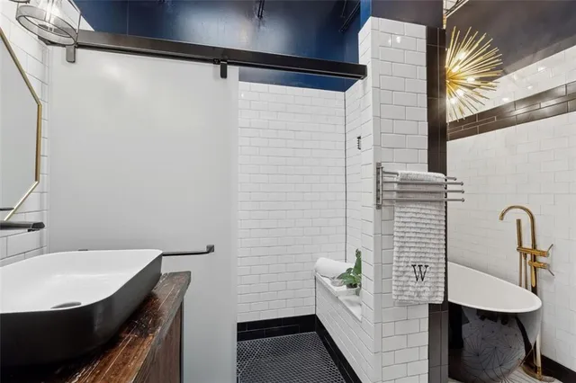 a bathroom with a sink and mirror