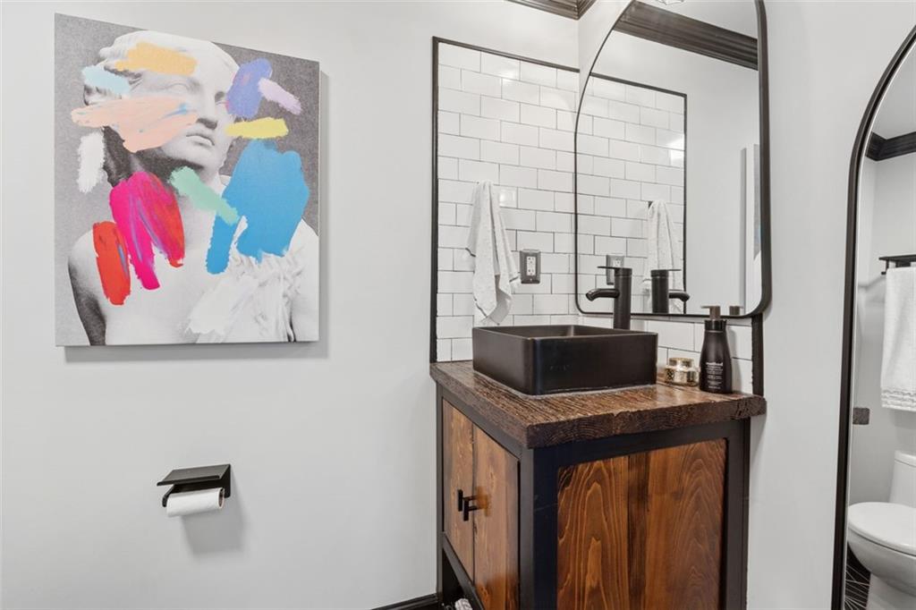 830 DeKalb Avenue Northeast, Unit 11 Atlanta, GA 30307 - Photo 24 of 37 a bathroom with a sink and a mirror