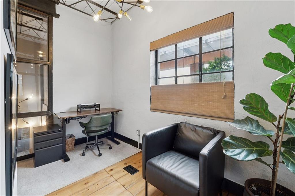 830 DeKalb Avenue Northeast, Unit 11 Atlanta, GA 30307 - Photo 27 of 37 a living room with furniture and a potted plant
