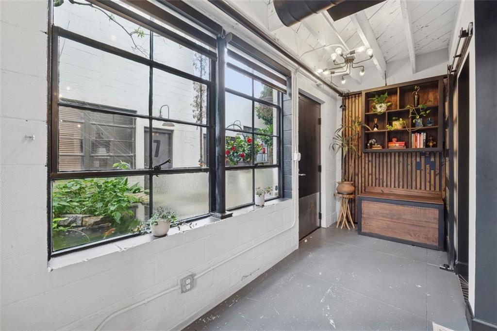 830 DeKalb Avenue Northeast, Unit 11 Atlanta, GA 30307 - Photo 34 of 37 a bathroom with a tub and window