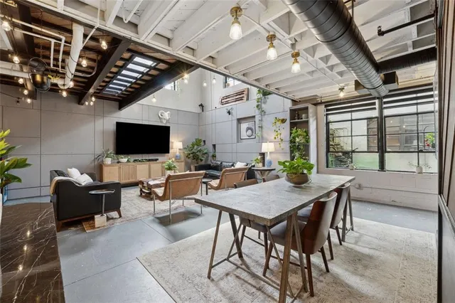 a livingroom with furniture and a flat screen tv