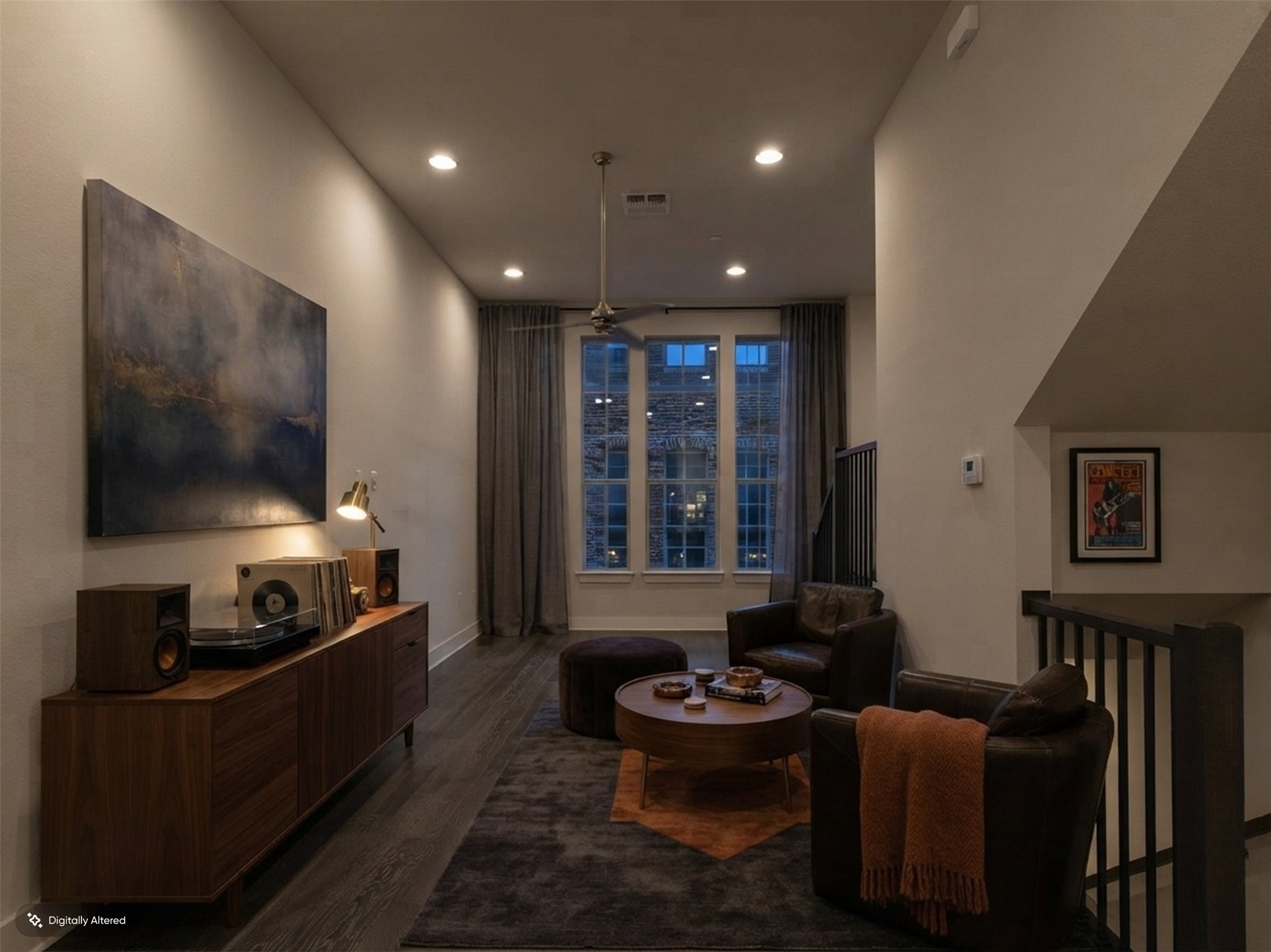 1308 Tinnin Ford Road, Unit 14 Austin, TX 78741 - Photo 15 of 40 High ceilings and rich wood flooring anchor this welcoming living area illuminated by recessed lighting.