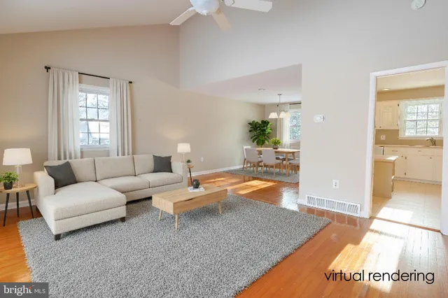a living room with furniture and a rug