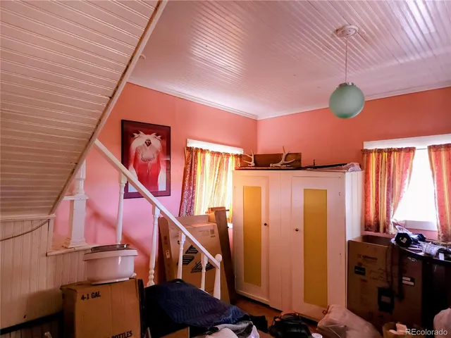 a room with furniture and gym equipment