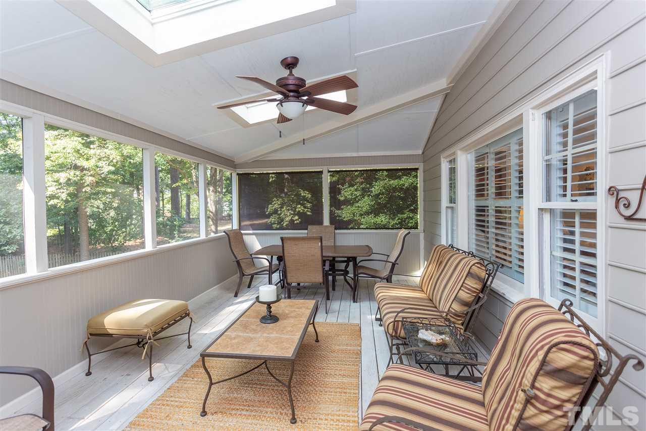 8609 Seagate Drive Raleigh, NC 27615 - Photo 2 of 28 Huge screened porch with room for dining and lounging.