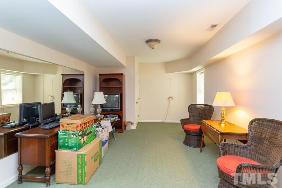 8609 Seagate Drive Raleigh, NC 27615 - Photo 23 of 28 Perfect area to set up for pool table, work out room! Basement has separate outside entrance.