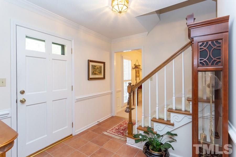 8609 Seagate Drive Raleigh, NC 27615 - Photo 4 of 28 Nice foyer entry with tile flooring. Perfect spot for the grandfather clock.