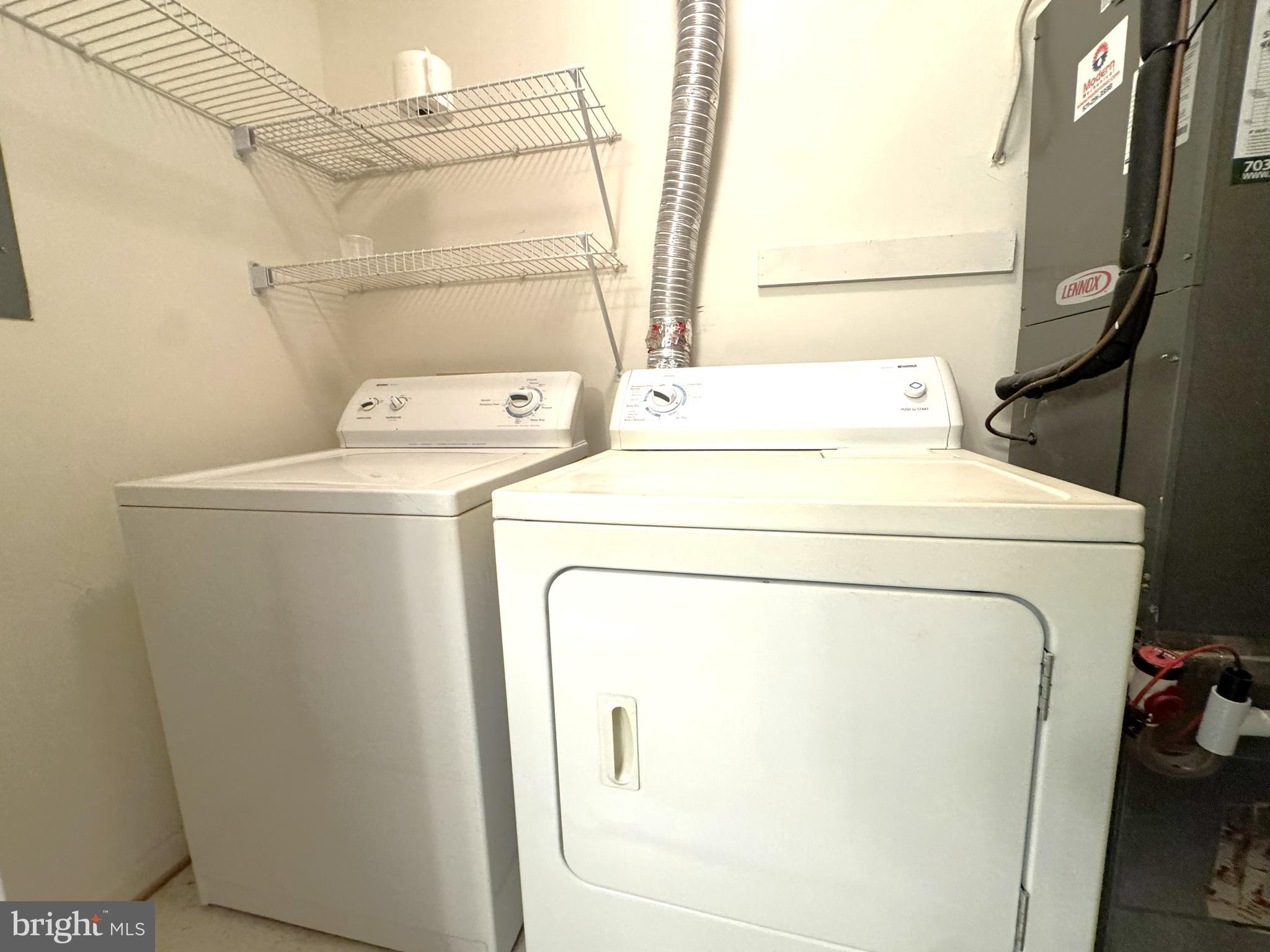 12012 Golf Ridge Court, Unit 102 Fairfax, VA 22033 - Photo 18 of 26 a utility room with dryer and washer