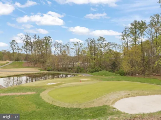 a view of lake with green space