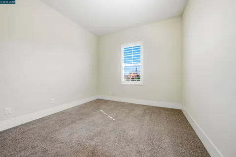 a view of entrance door with wooden floor