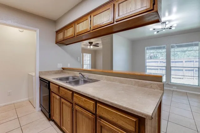 a kitchen with a stove and a sink