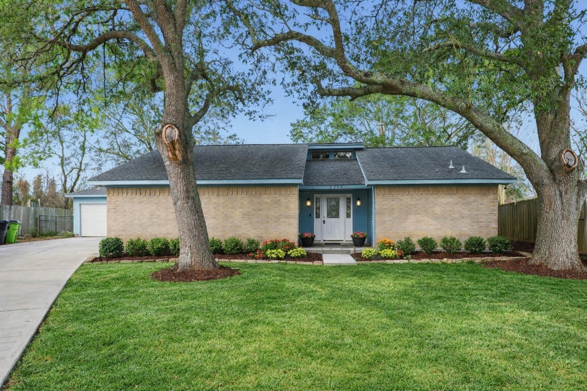 2000 Hamilton Street Rosenberg, TX 77471 - Photo 2 of 50 a front view of a house with a yard and a large tree