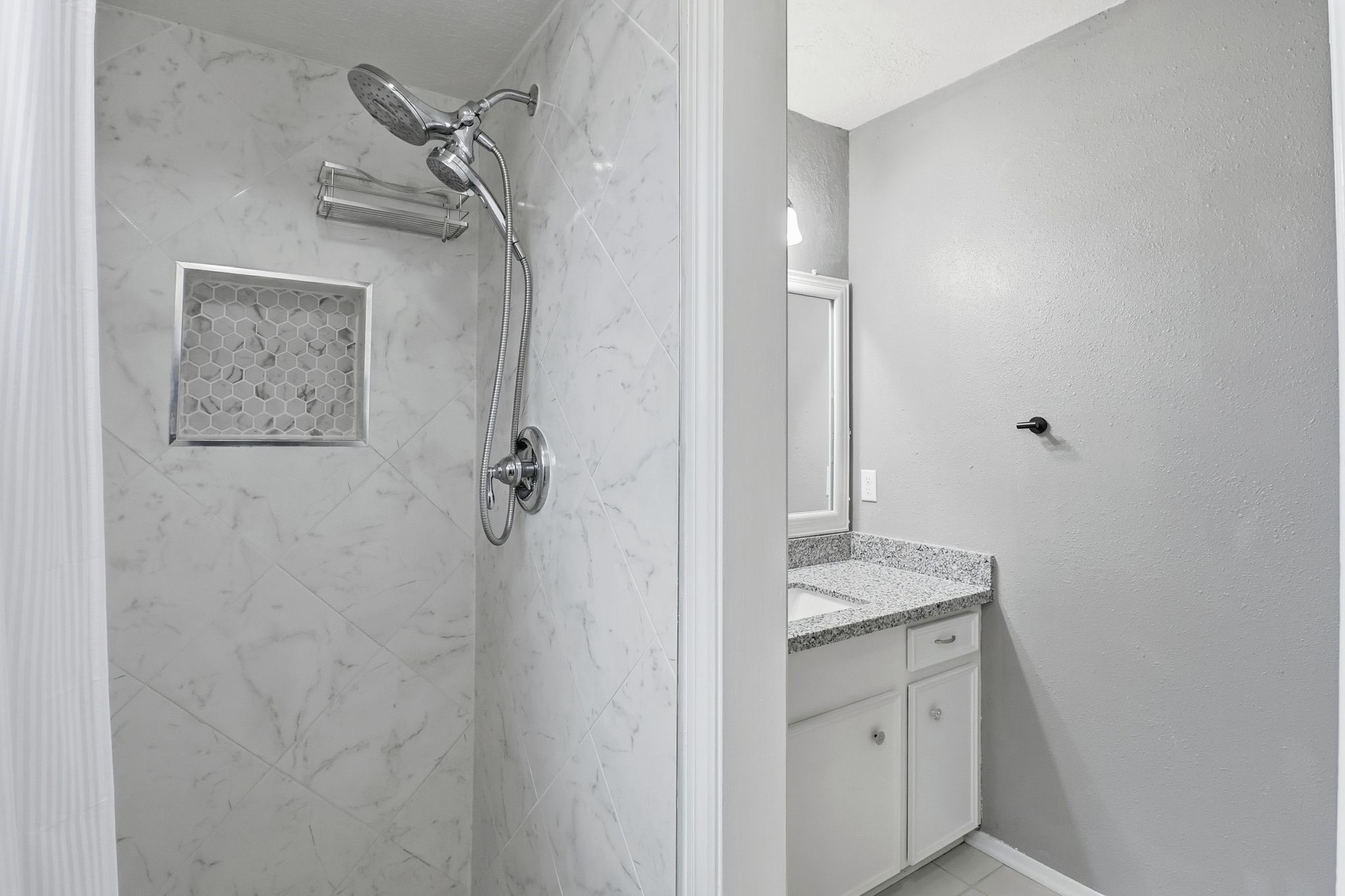 2000 Hamilton Street Rosenberg, TX 77471 - Photo 21 of 50 a bathroom with a granite countertop sink a mirror and shower