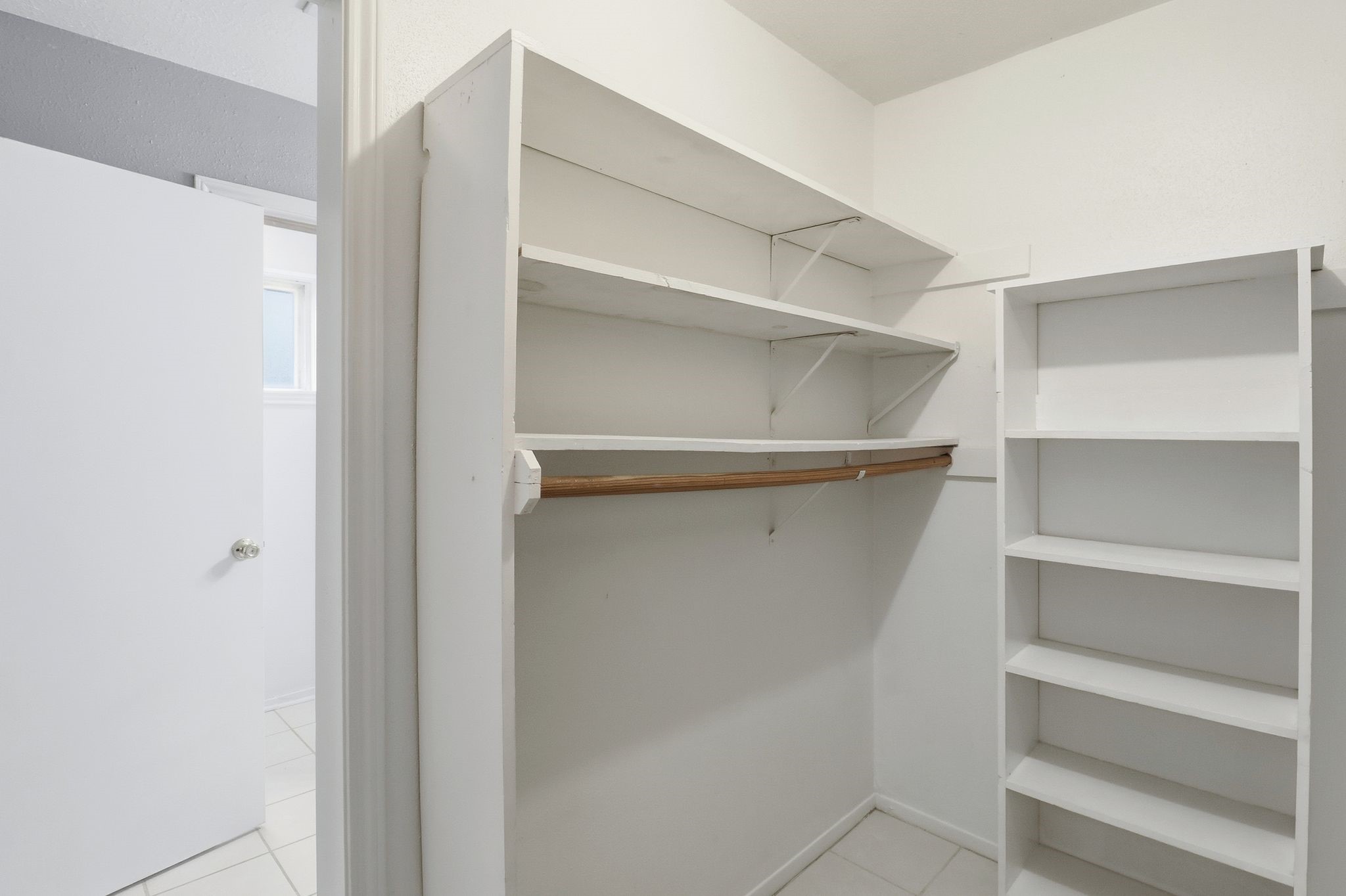 2000 Hamilton Street Rosenberg, TX 77471 - Photo 23 of 50 a view of walk in closet with empty racks