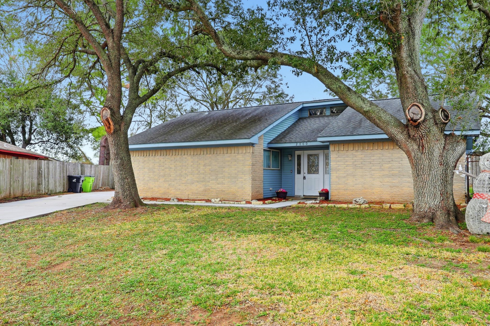 2000 Hamilton Street Rosenberg, TX 77471 - Photo 4 of 50 a view of a house with a yard and tree s