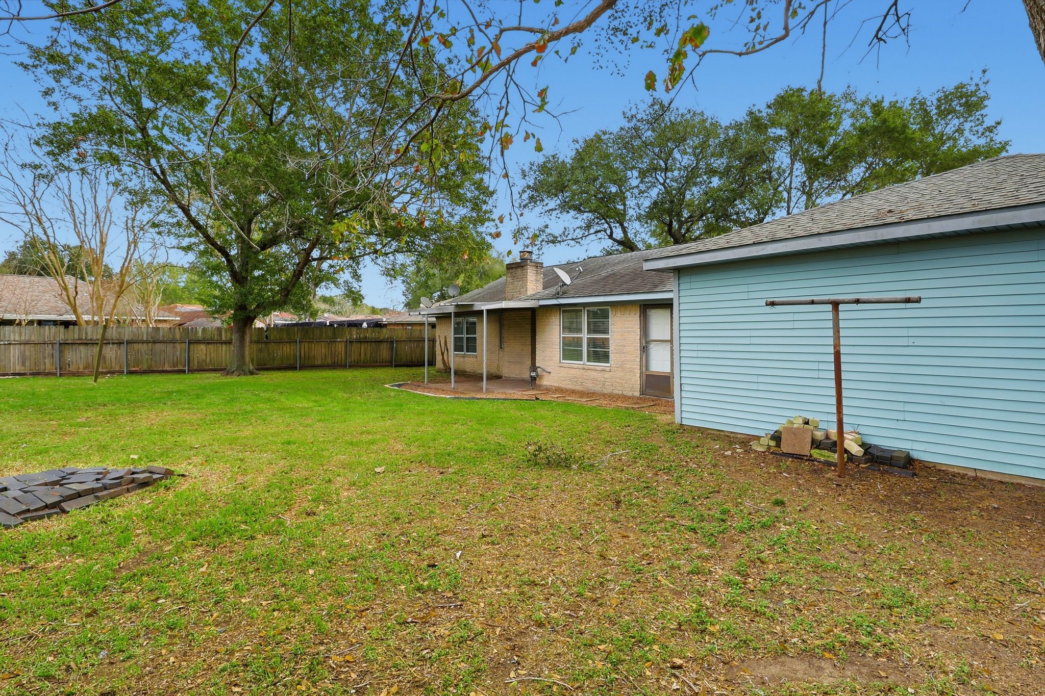 2000 Hamilton Street Rosenberg, TX 77471 - Photo 43 of 50 a view of a house with backyard and a tree