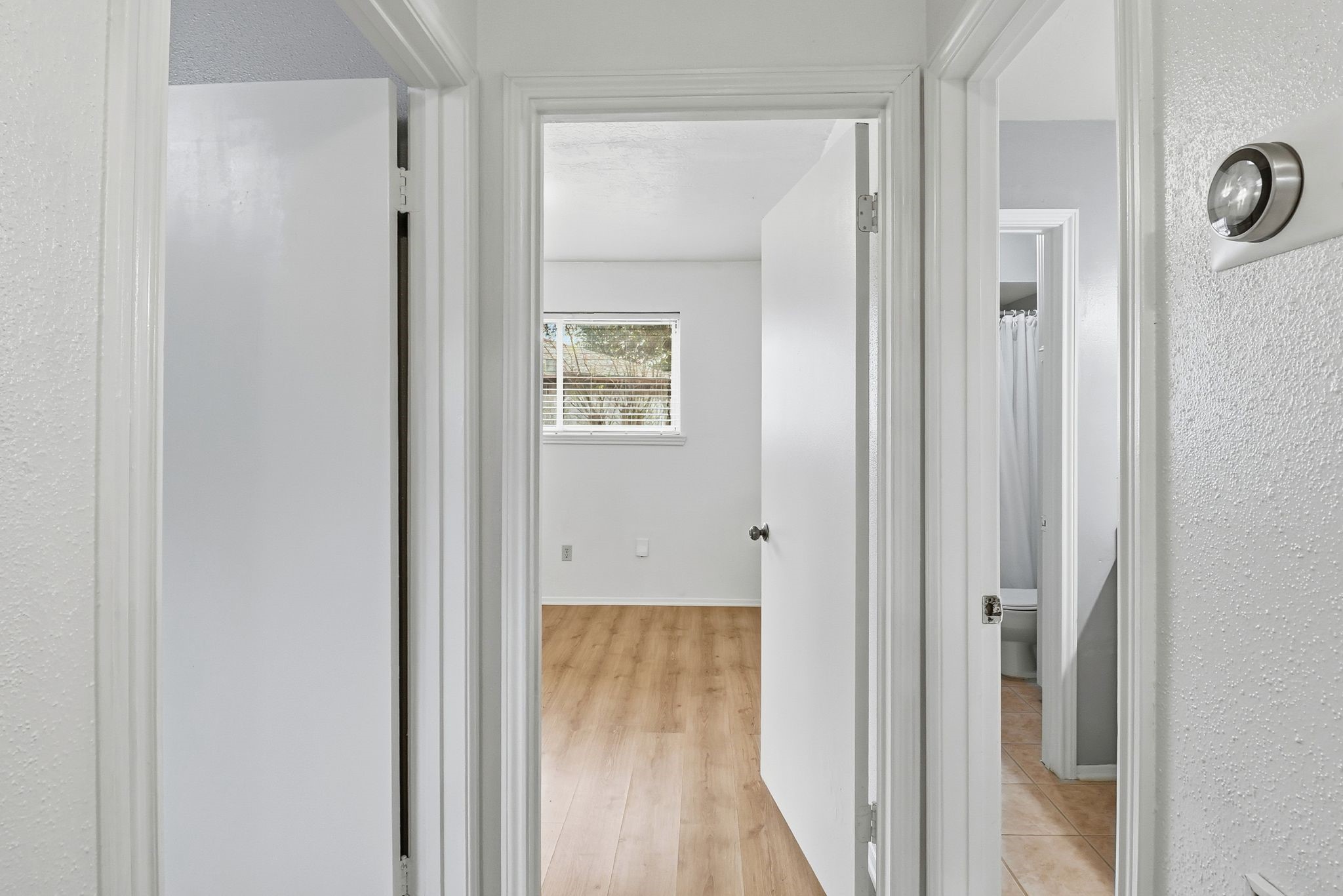 2000 Hamilton Street Rosenberg, TX 77471 - Photo 9 of 50 a view of a bathroom from a hallway
