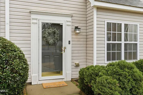 a front view of a house with a glass door