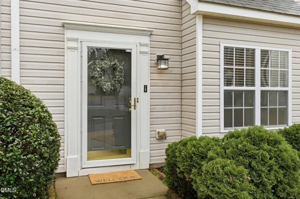 a front view of a house with a glass door