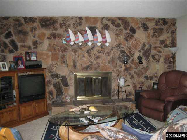 4320 Warren Way Reno, NV 89509 - Photo 4 of 9 a living room with furniture and a fireplace