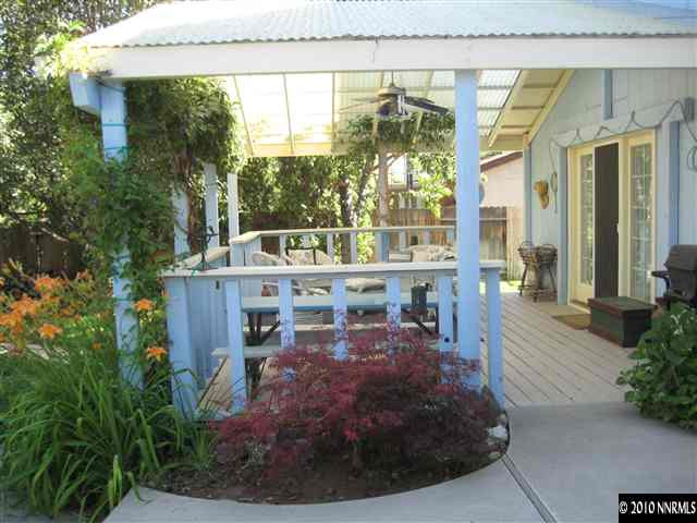 4320 Warren Way Reno, NV 89509 - Photo 7 of 9 a view of a house with a porch and furniture