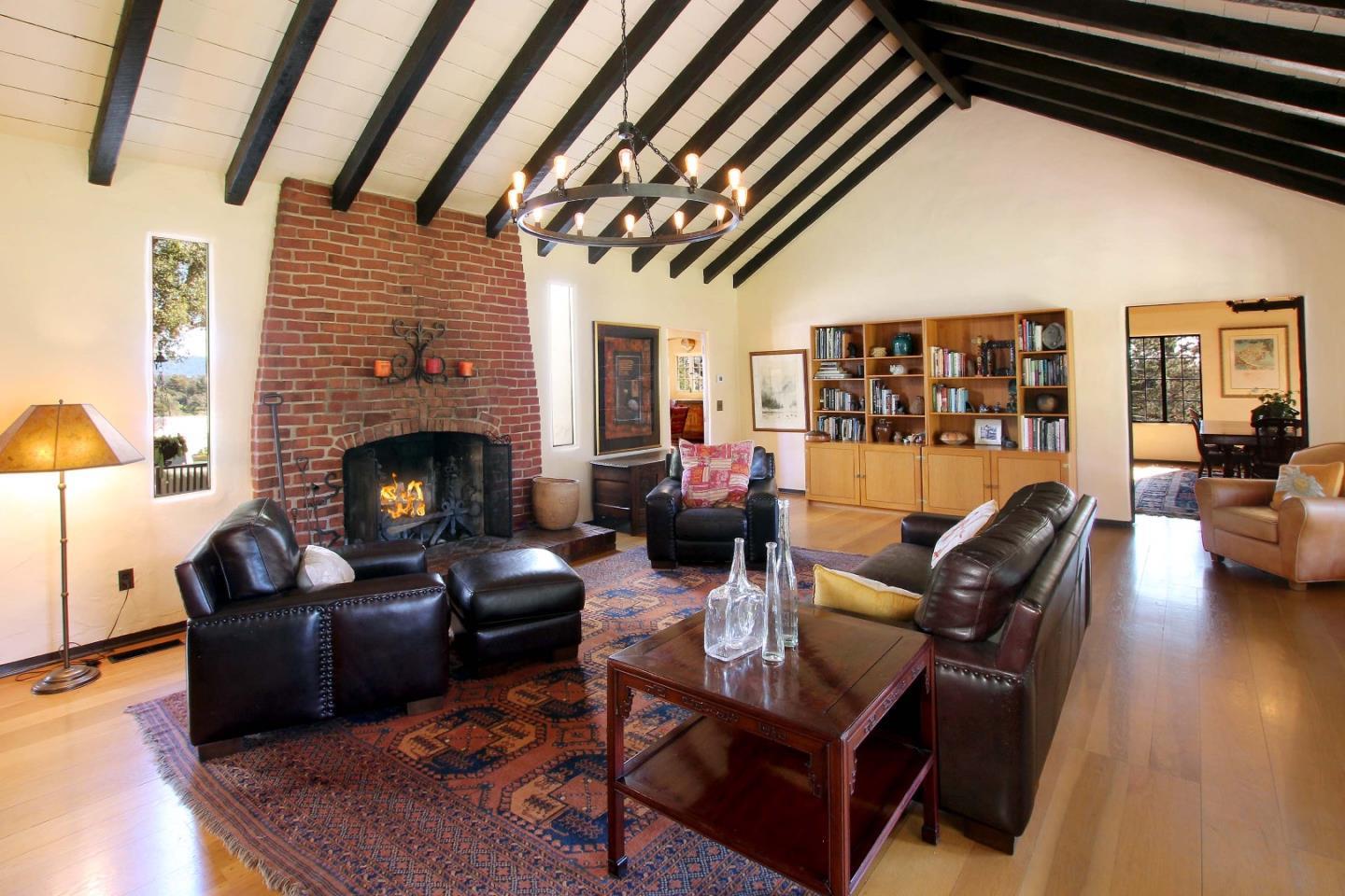 401 Eagle Ridge Corralitos, CA 95076 - Photo 5 of 19 a living room with furniture and a fireplace